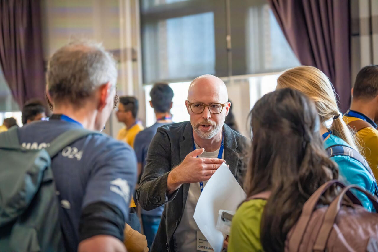 Matthew Miller facilitating team formation at Code Hack 2024